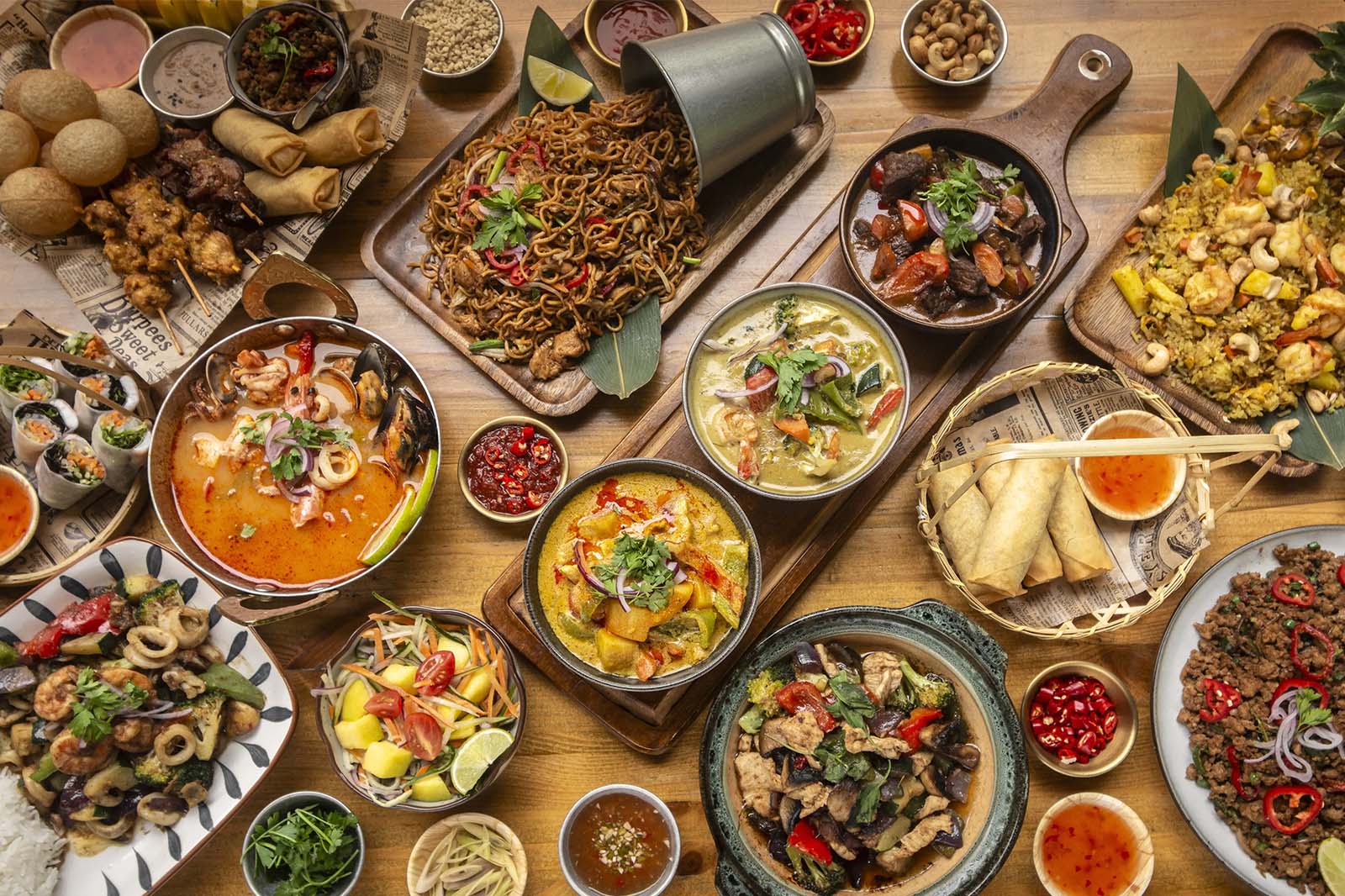 Evergreen Thai group catering table with curries, noodles, spring rolls, and shared dishes for a downtown Toronto office meal